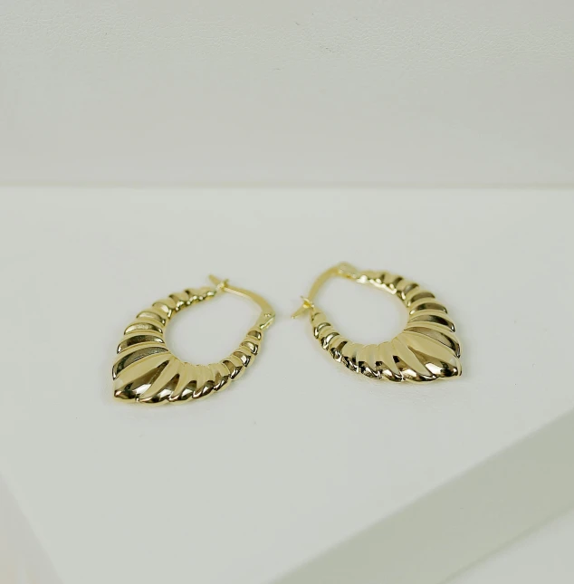 two - tone gold hoop earrings with twisted edges