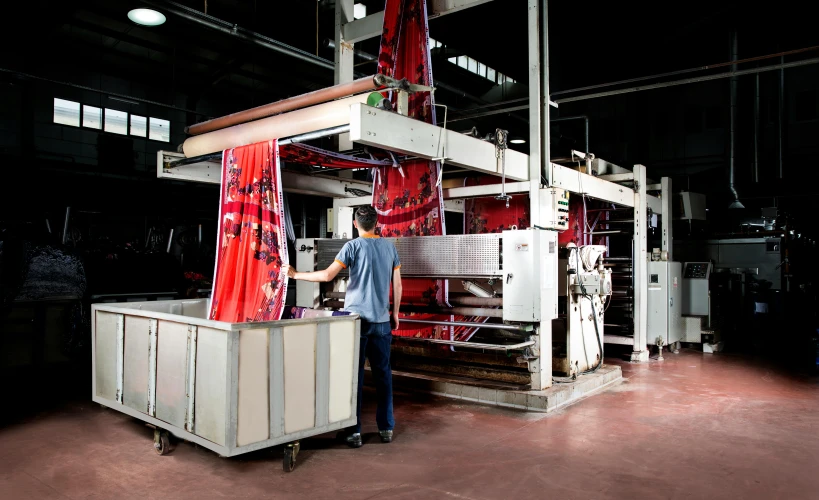 a man looks at machinery in the dark