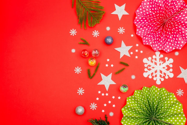 decorative paper christmas decorations on a red background