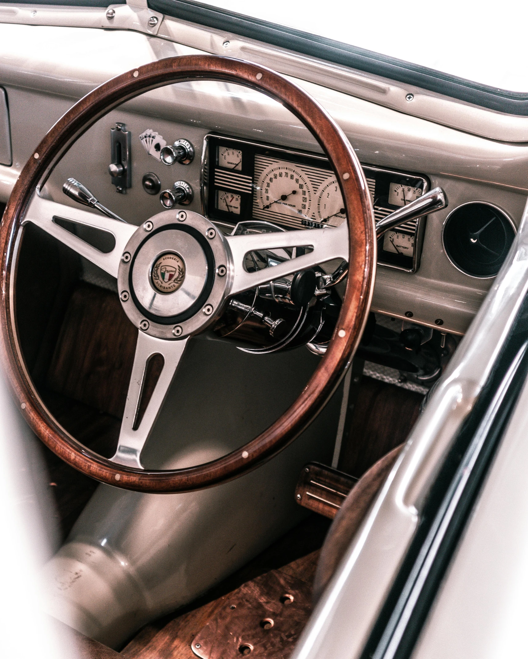 a car with wooden steering wheel is shown