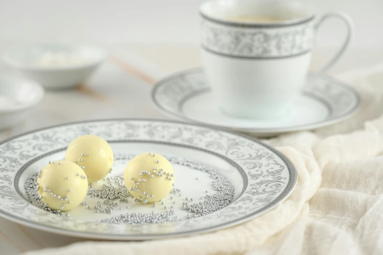 two cake balls are sitting on a plate