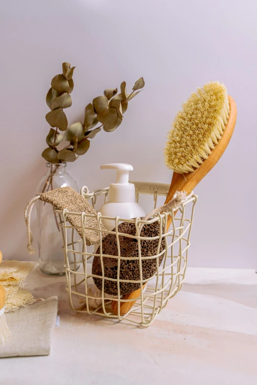 two bathroom products in baskets and one with a brush