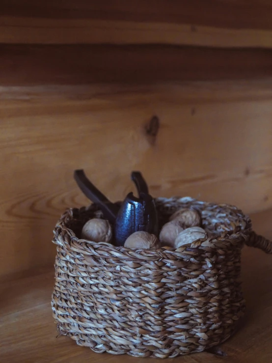 a basket of shells and black metal scissors