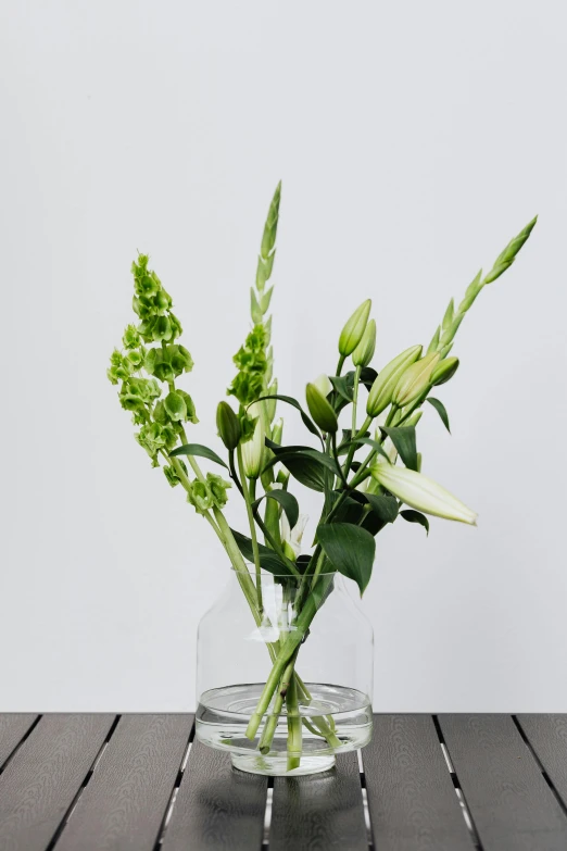 flowers are placed inside of an clear bowl