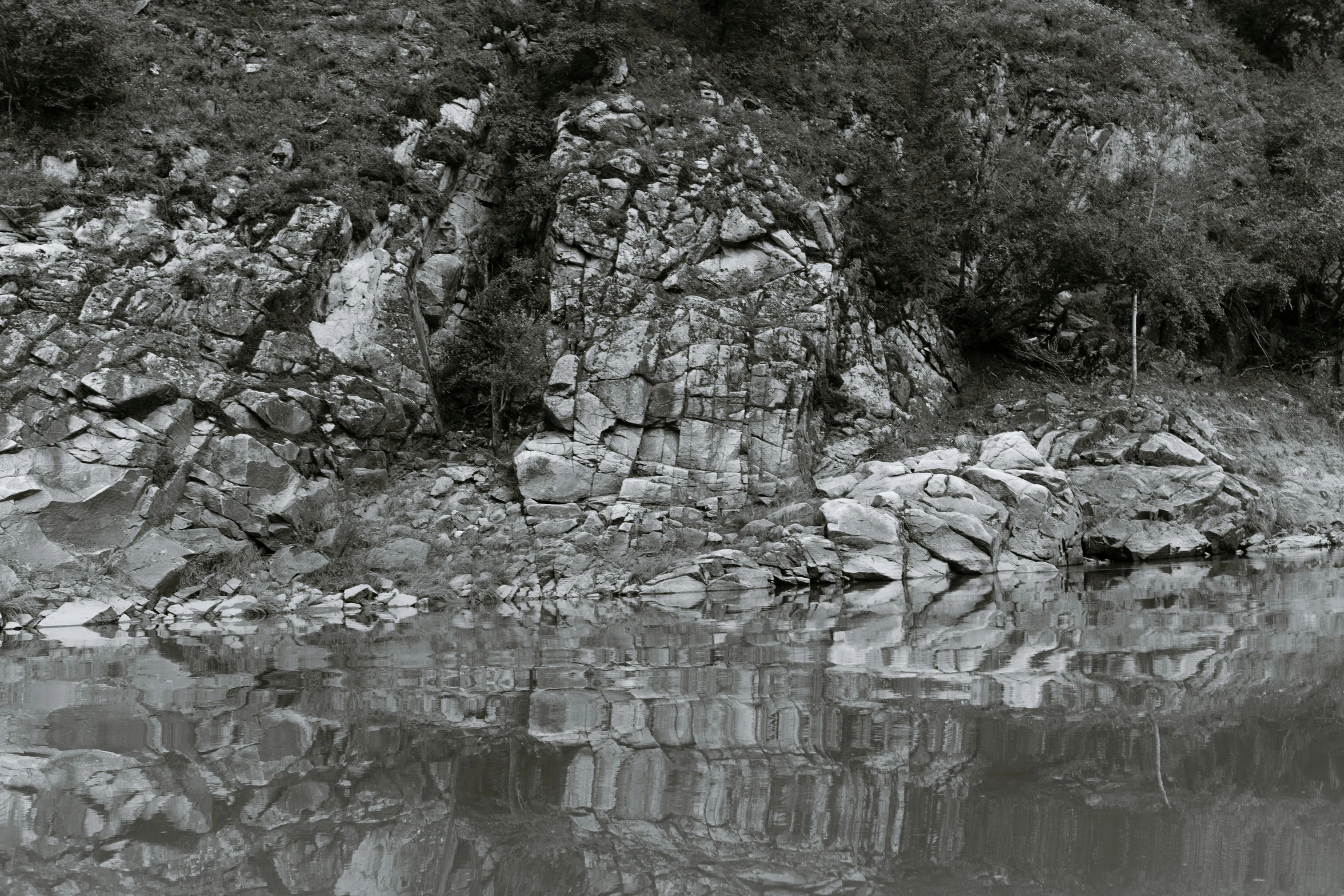 an old po shows rocks and the water