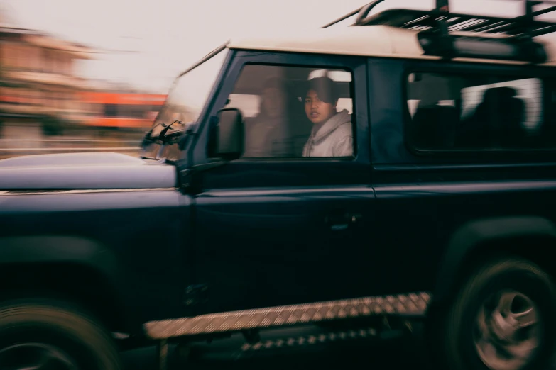 the driver inside the jeep is blurry and looks like it may be about to crash