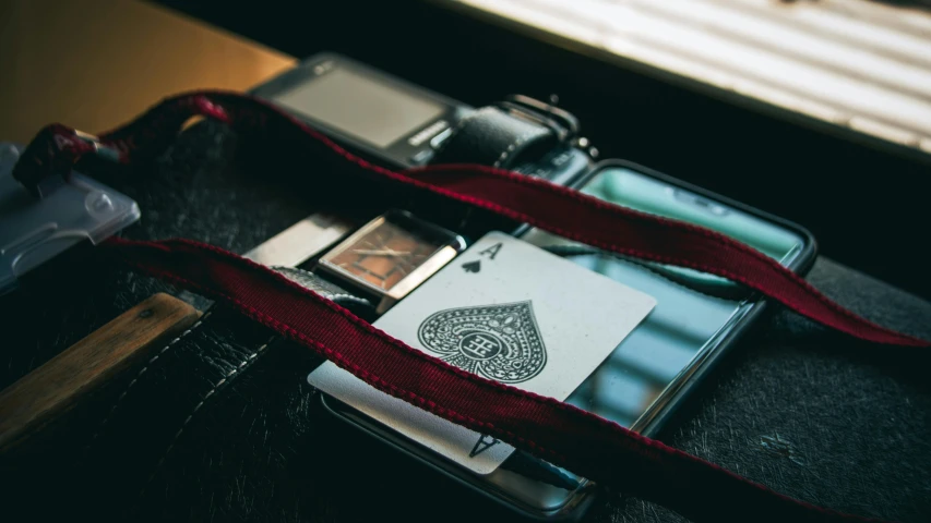 a cell phone laying on top of a table next to an object