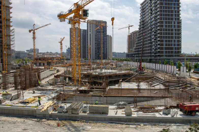 a building construction site is under repair and people are watching