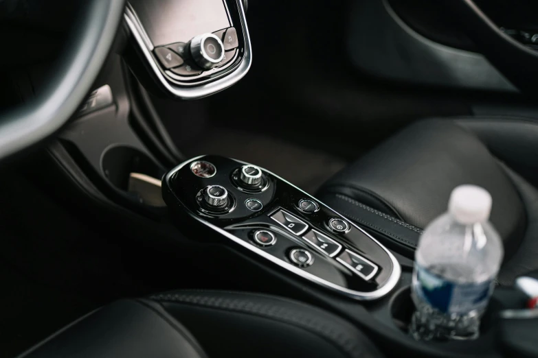 an image of a car control panel with cup holders