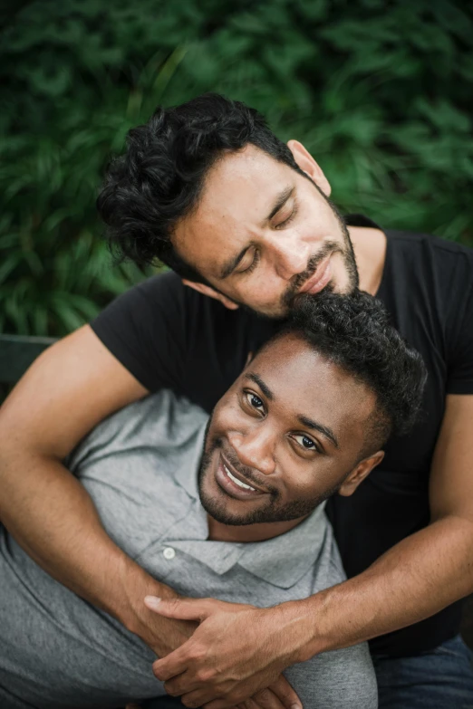 the young couple is hugging while taking a moment together