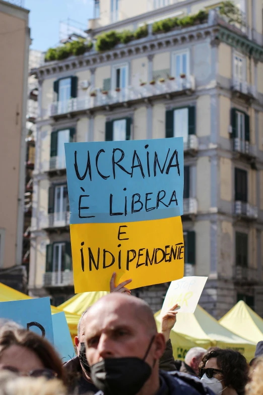 a protest in front of an apartment building