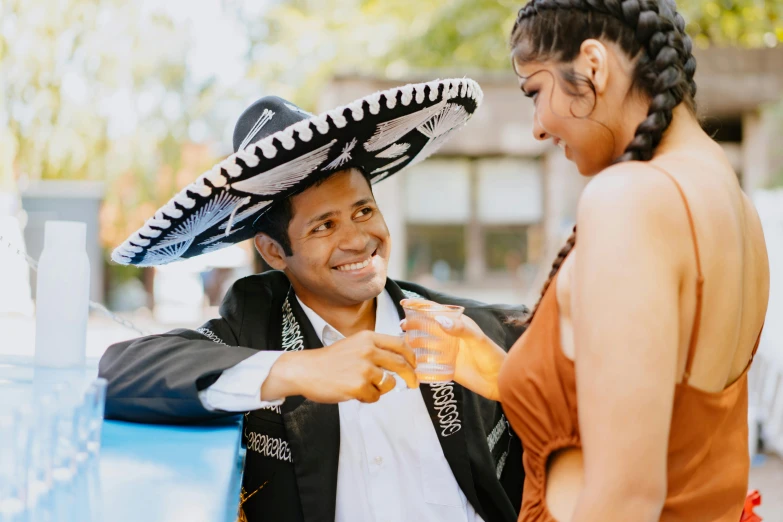 a young woman getting a drink from a bartender