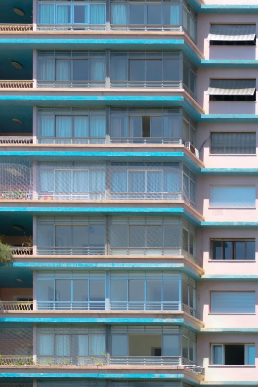 many balconies in the windows of an apartment building