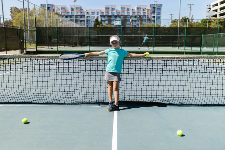 the boy is on a tennis court preparing to hit the ball