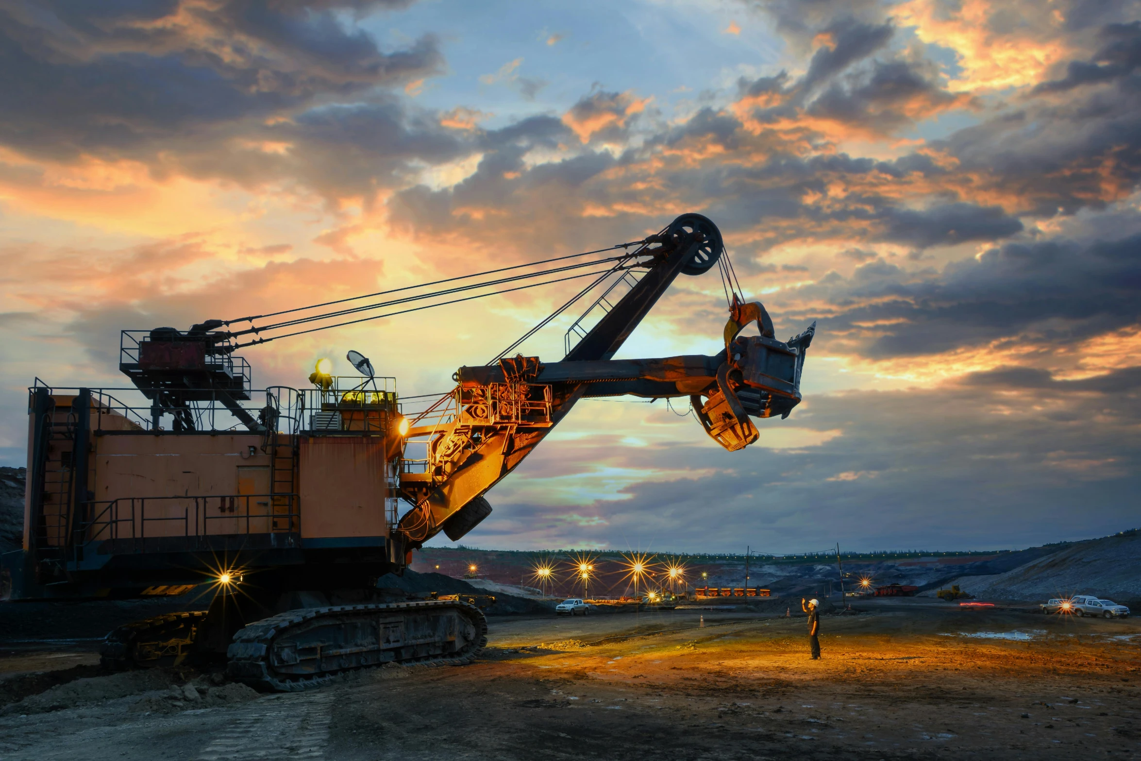 a heavy machinery in the evening on a field