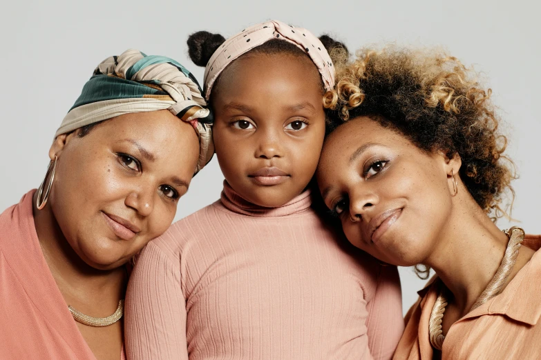 the three women are smiling together posing for a picture