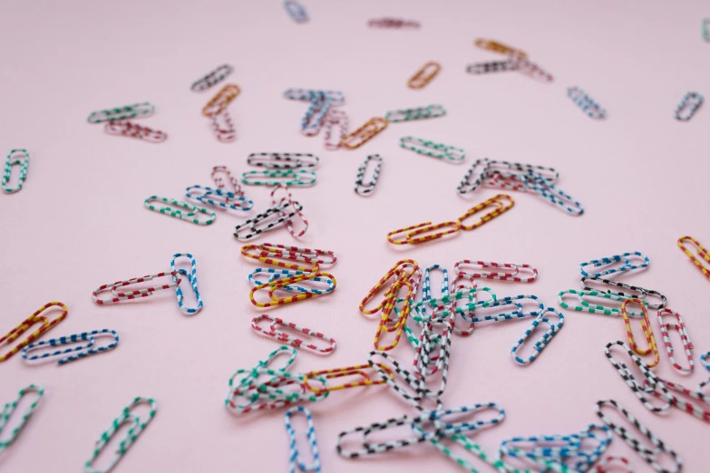 many links of colored plastic wrap around on a table