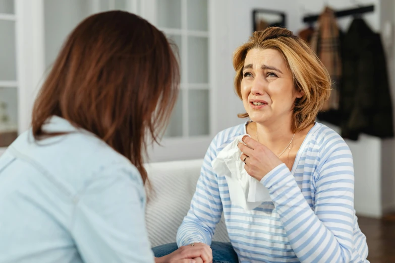 woman sitting down to talk to another woman