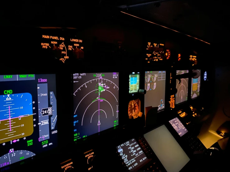 a plane dashboard with multiple screens showing airline flight information