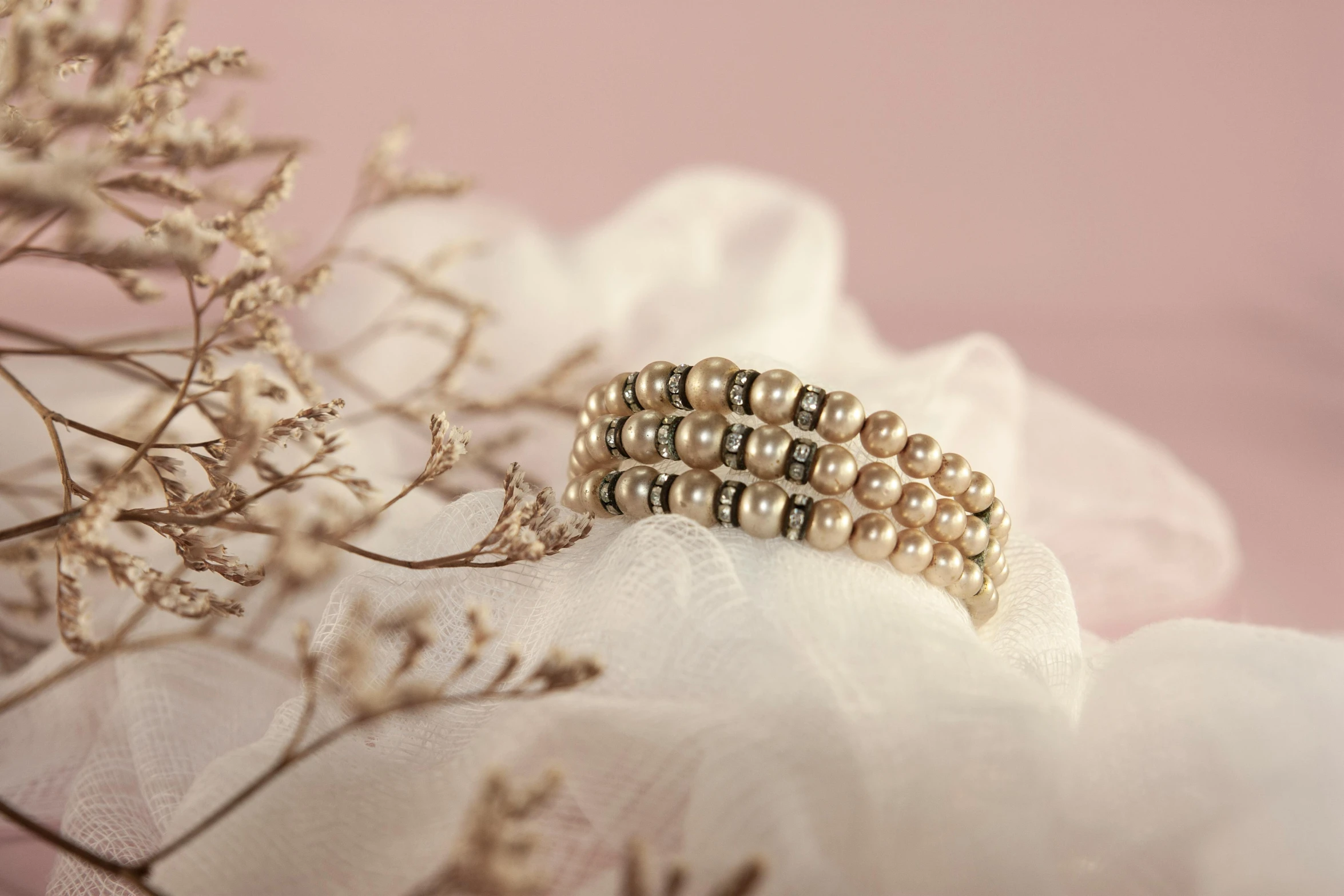 wedding bands adorned with small pearls and swaroons