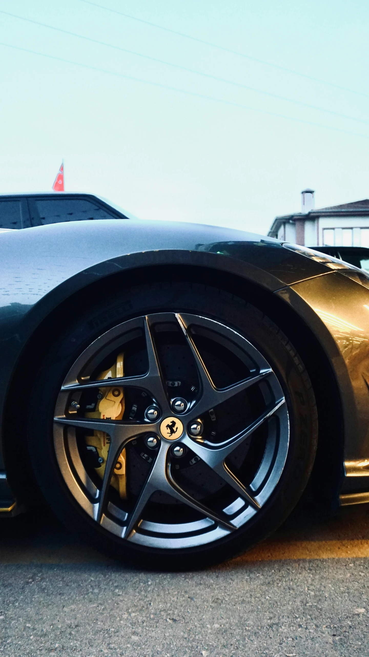 a gold sports car is seen on the street