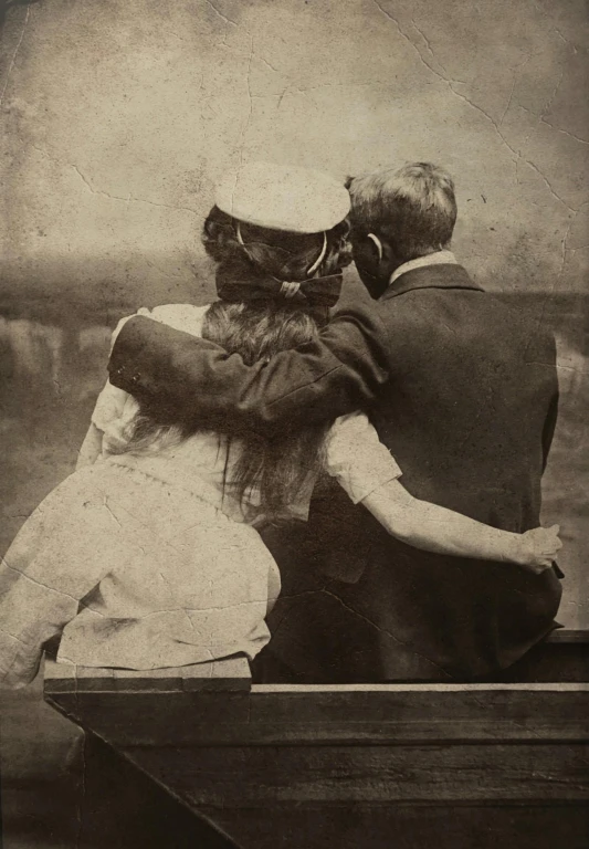 a black and white po shows two people on a boat