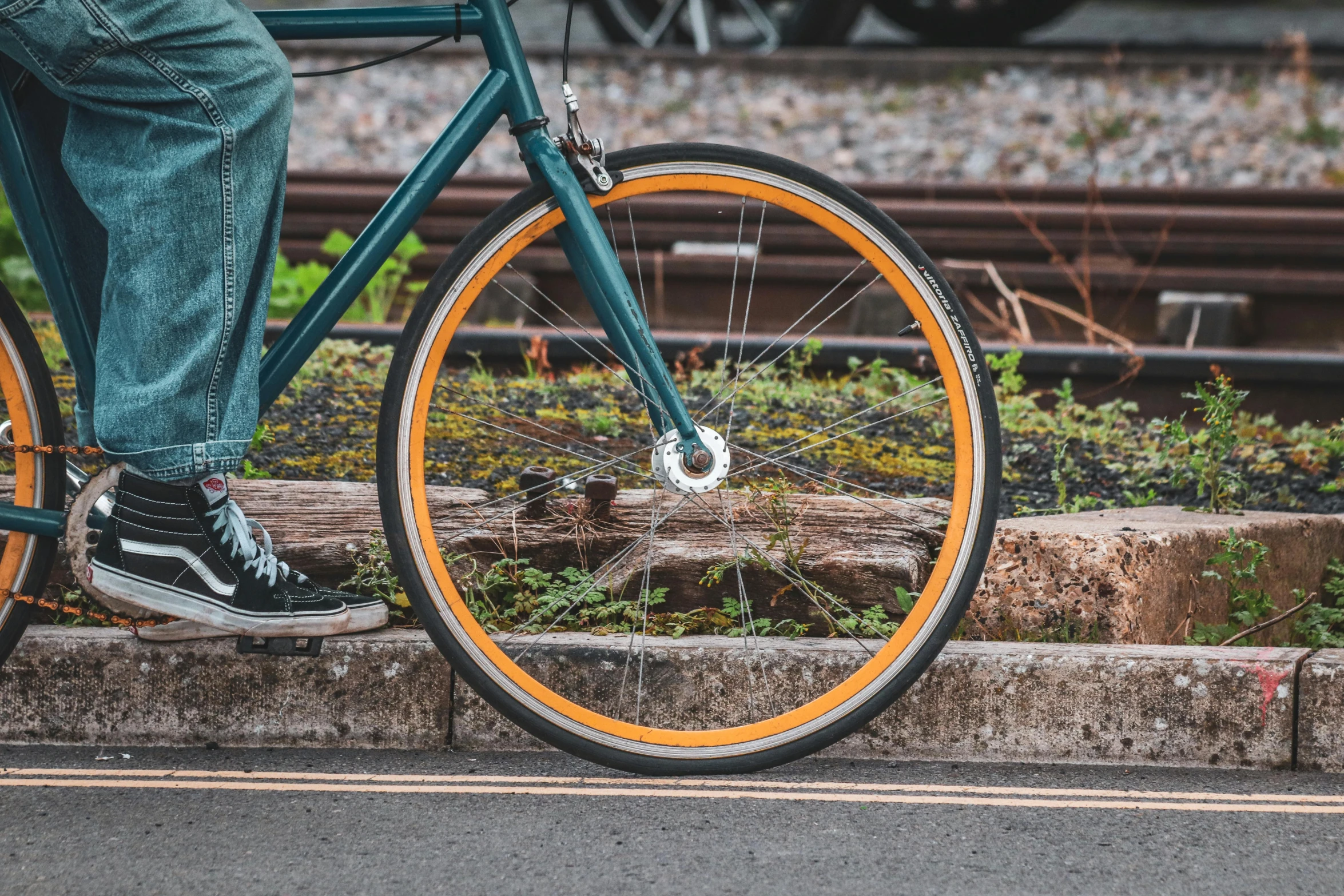 a person is riding a bicycle down the street