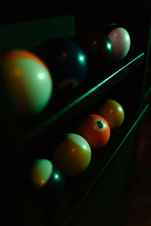 eight balls are lined up in an area