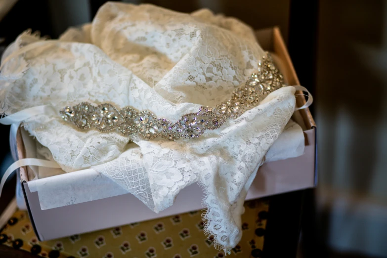 an elegant white bridal and ivory lace ribbon set in a box