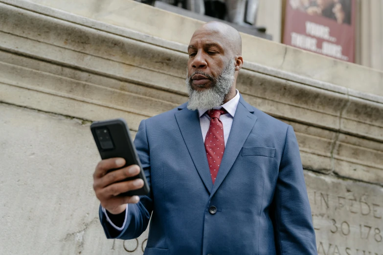 a man wearing a suit with a white beard