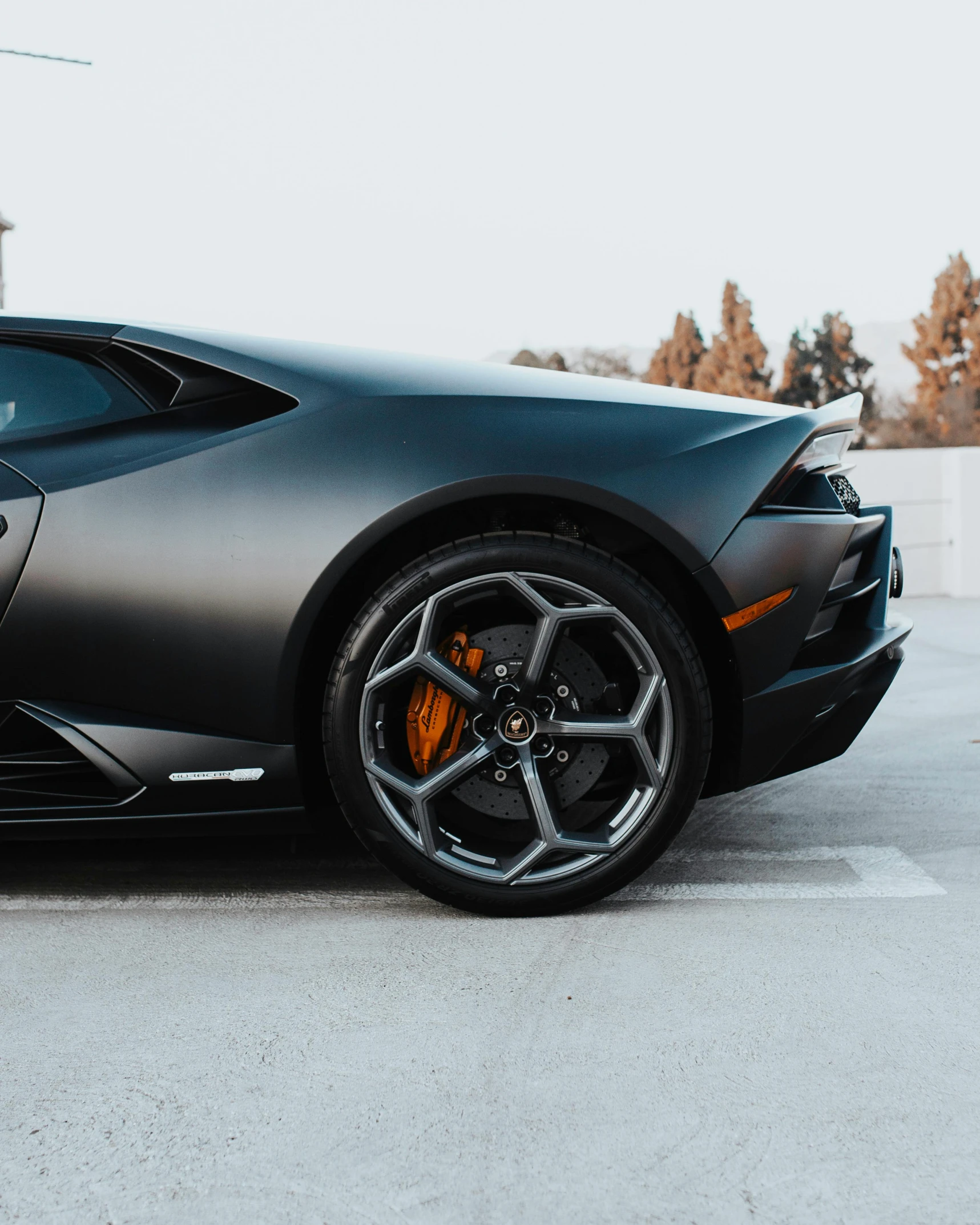 a black sport car parked on the street