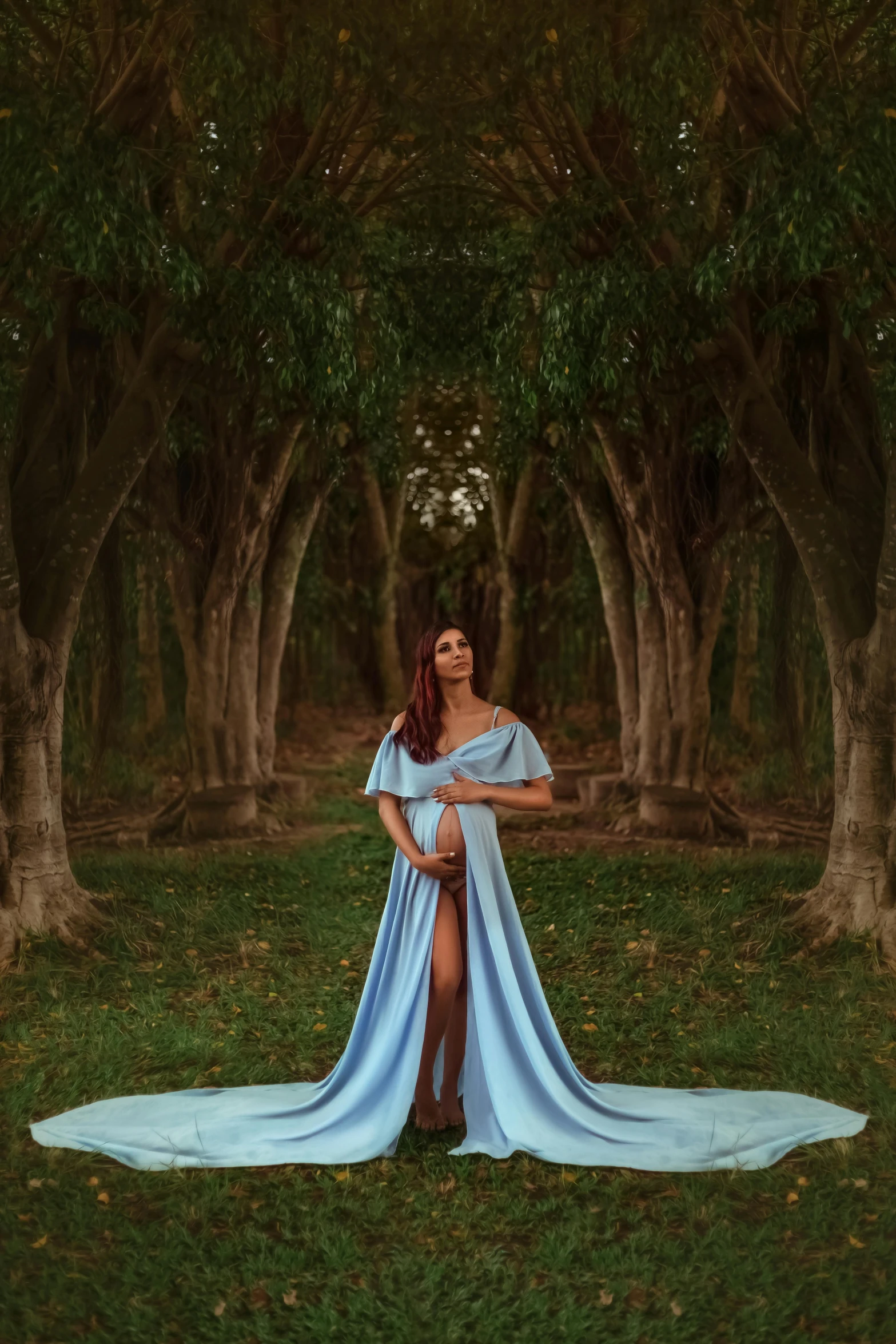 a woman in a dress standing next to some trees