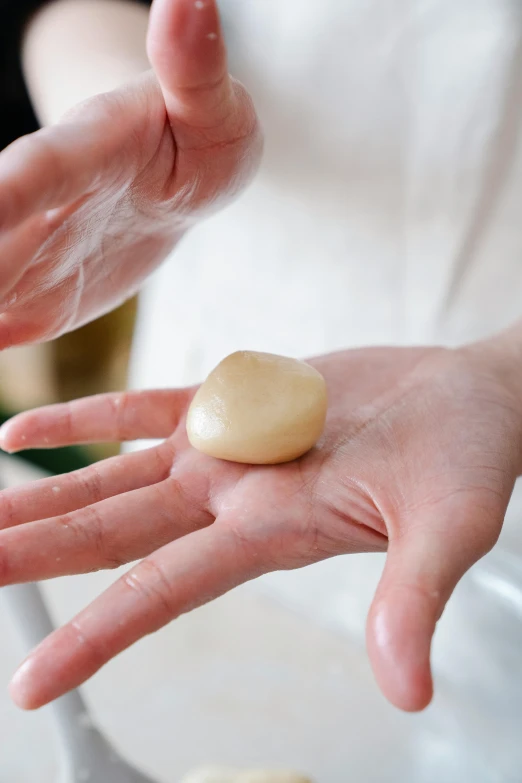 a person that is holding some food in their hand