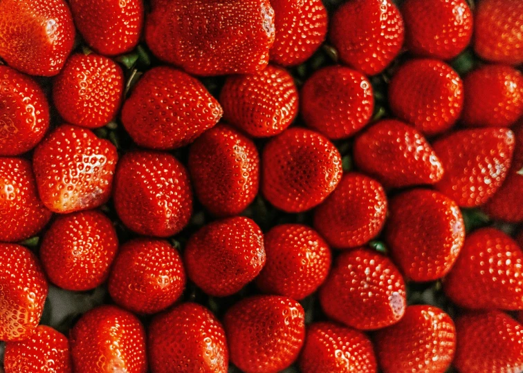 a close up picture of several strawberries