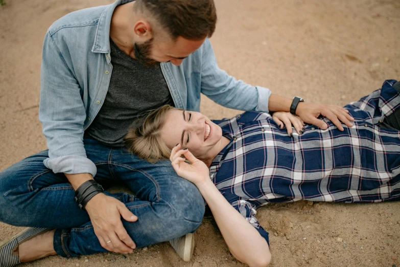 the young couple is sitting next to each other, together