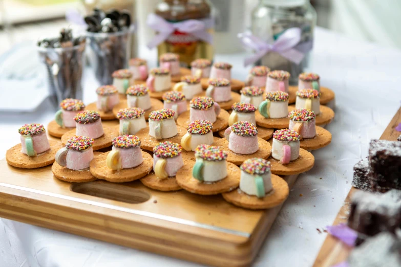 a table that has many desserts on top of it