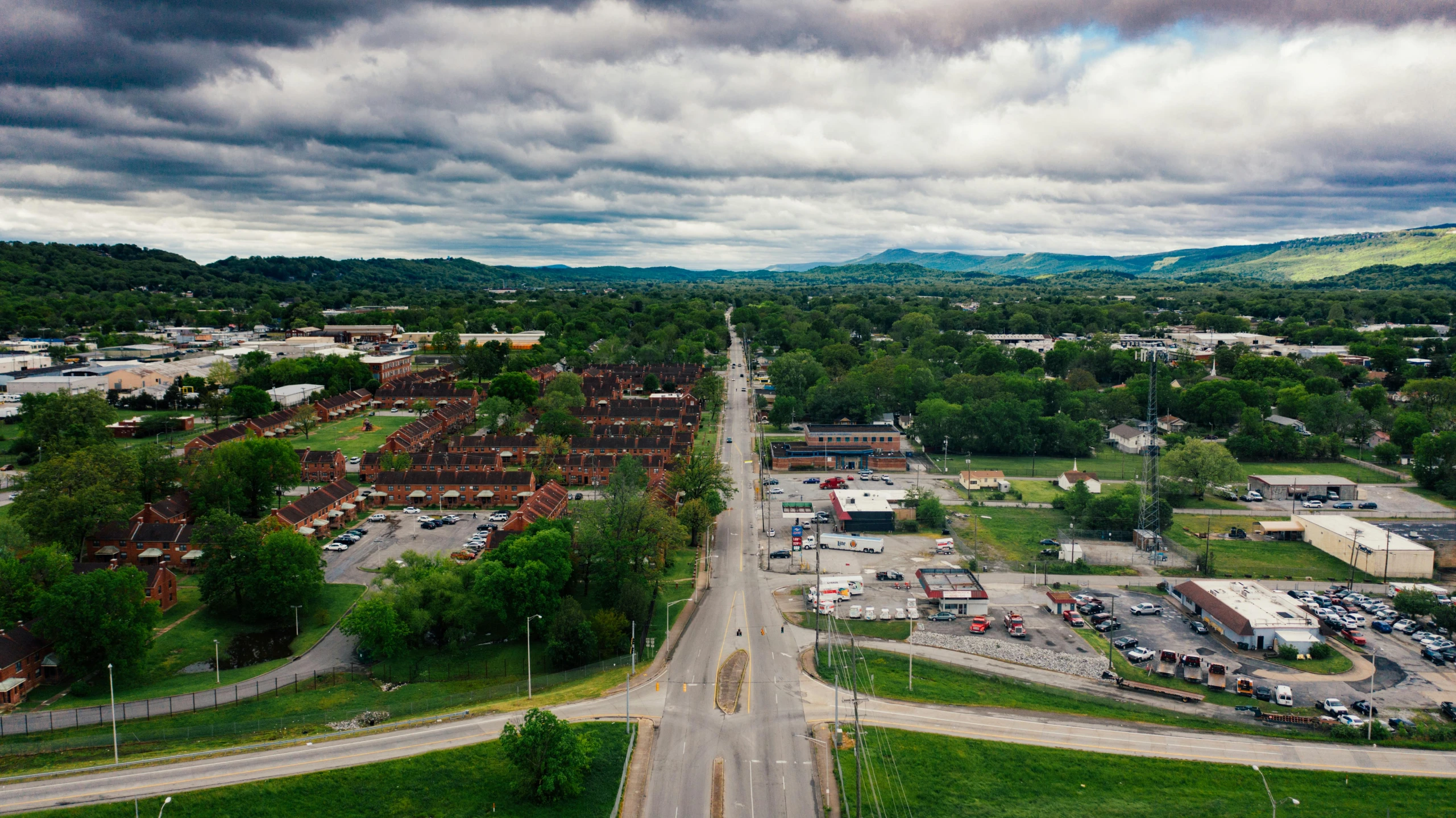 an overhead view of an outside city with cars and people