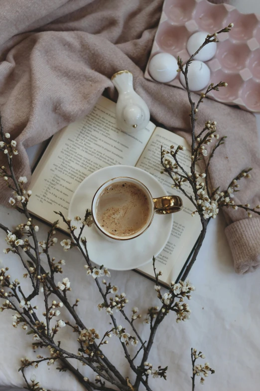 there is a coffee cup and saucer on the table