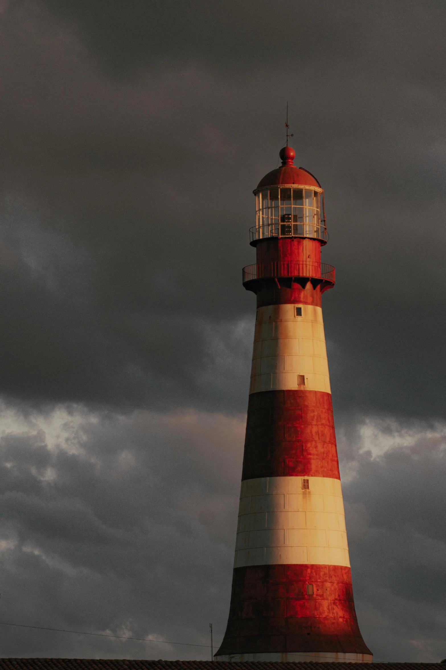 a picture of a red and white lighthouse