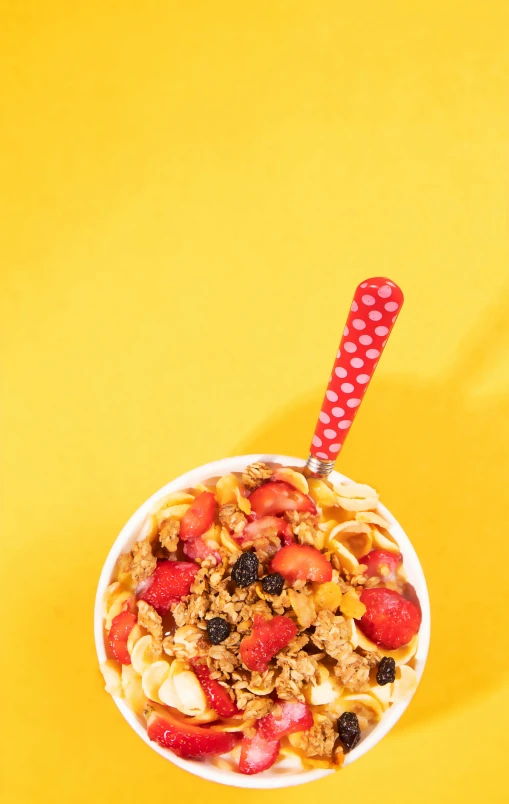 a bowl with cereal, granola and other items in it