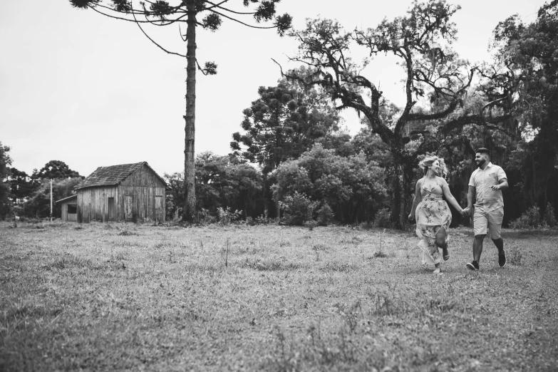 a black and white po of a couple holding hands