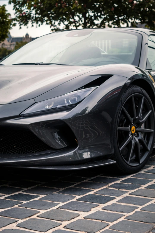 a car with chrome accents is parked on the street