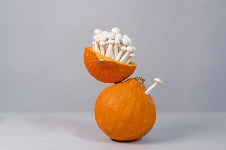 a group of mushrooms sitting on top of oranges