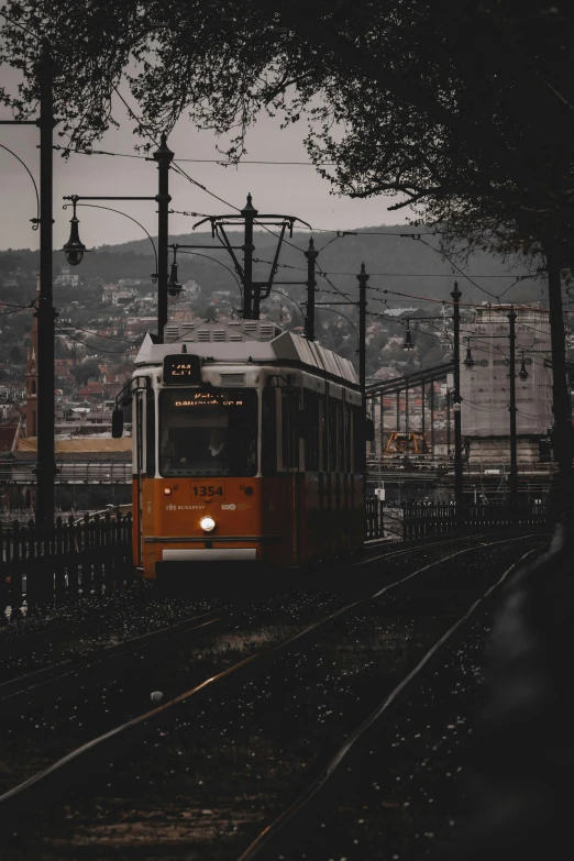 a train traveling down tracks next to a city