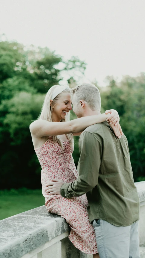 a man and woman are hugging and cuddling