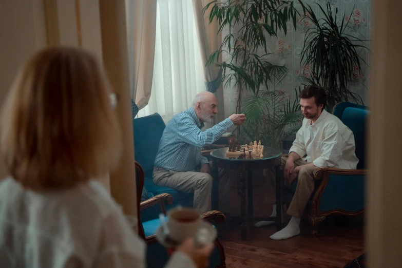 man and woman sitting together playing a game of chess