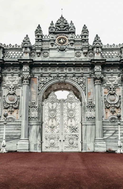 an old stone gate is made of carving