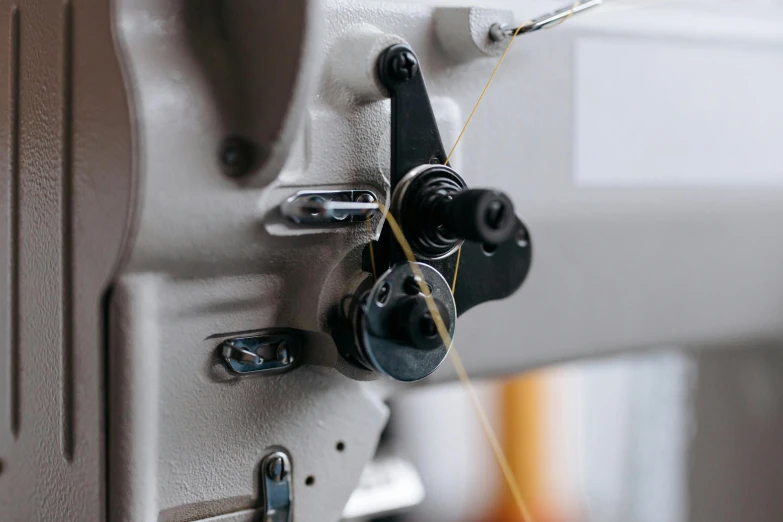 a close up s of someone sewing soing on a machine