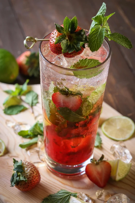 a strawberry tea on top of a wooden board