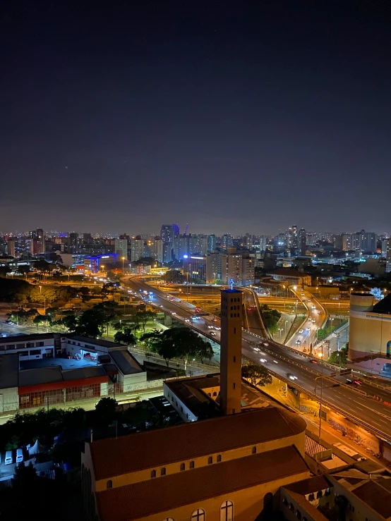 a night view of the city from a top floor room